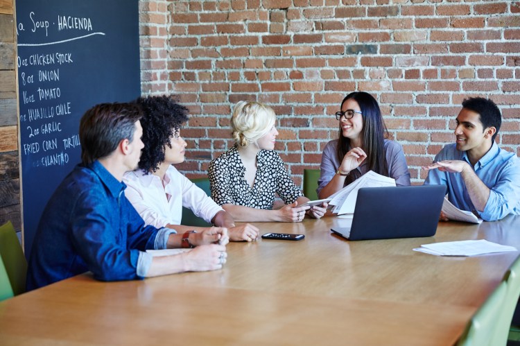 a sales team engaging with Einstein AI in a meeting