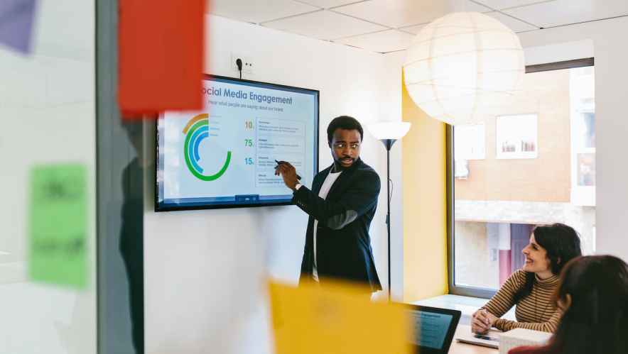 Man giving a sales pitch in a conference room