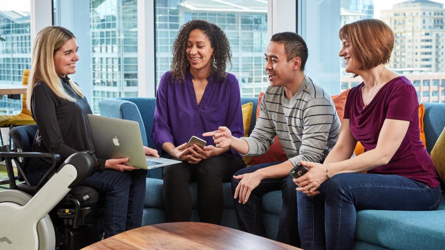 diverse people sitting on a couch during a meeting