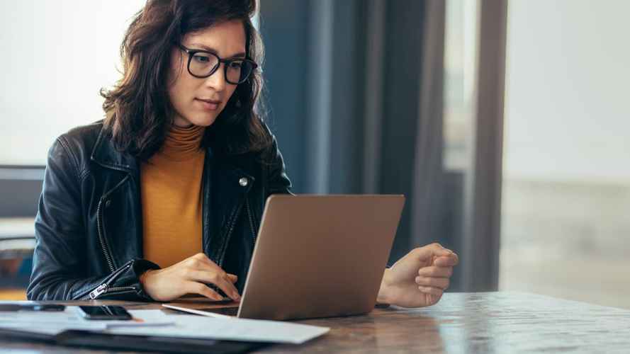 Woman using the computer for customer self service