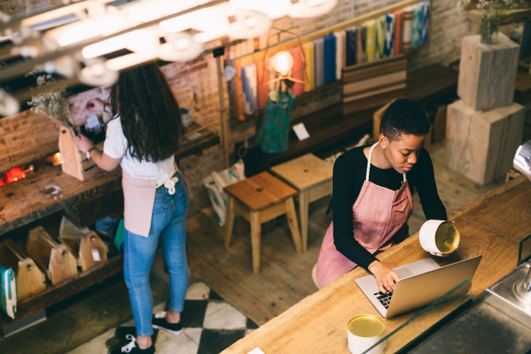 Female shop owners working in their store