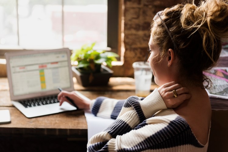 Woman typing on her laptop