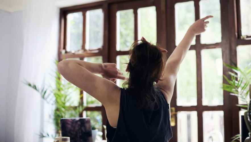 Person dancing and listening to music