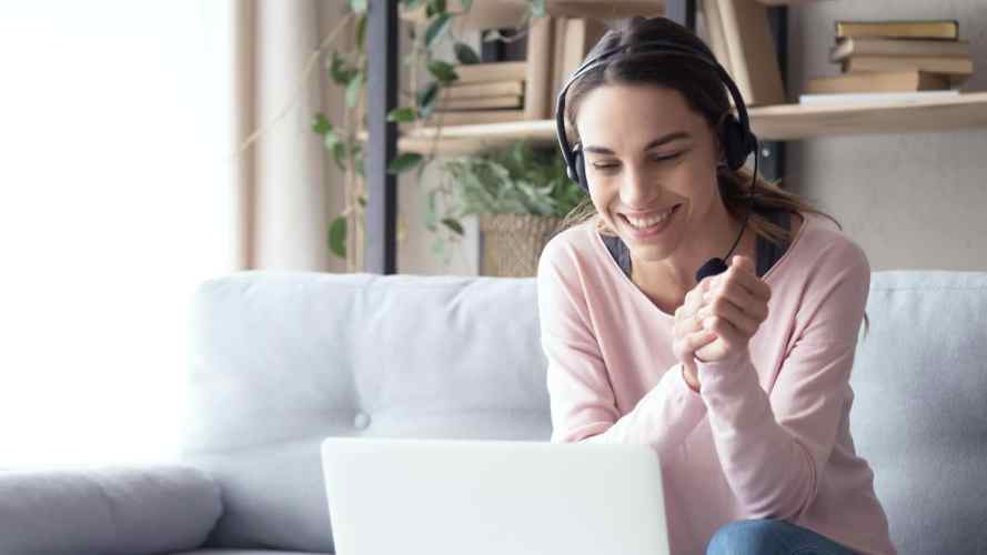 Service rep takes a call from her laptop