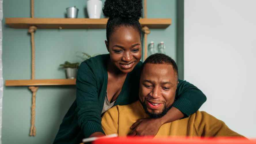 Couple checkout their laptop