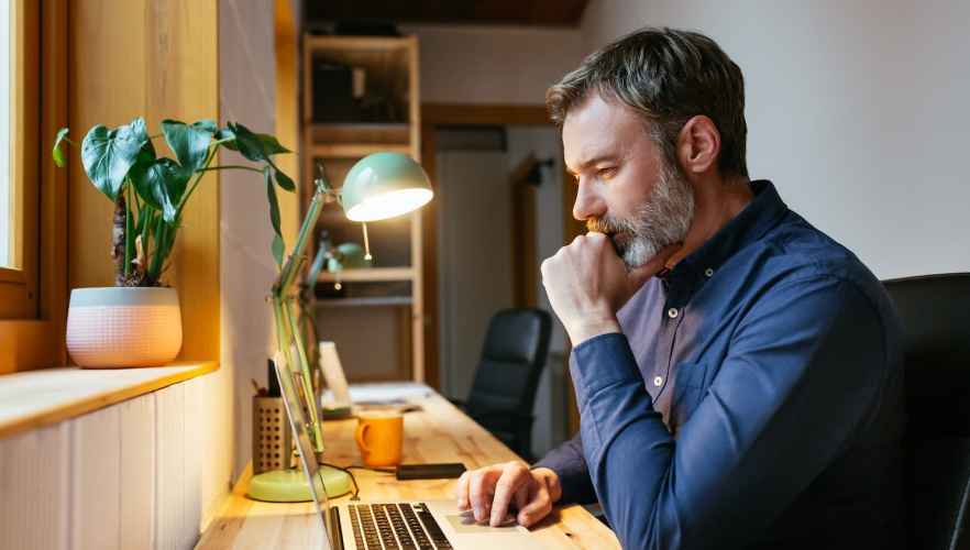 Man works on his laptop