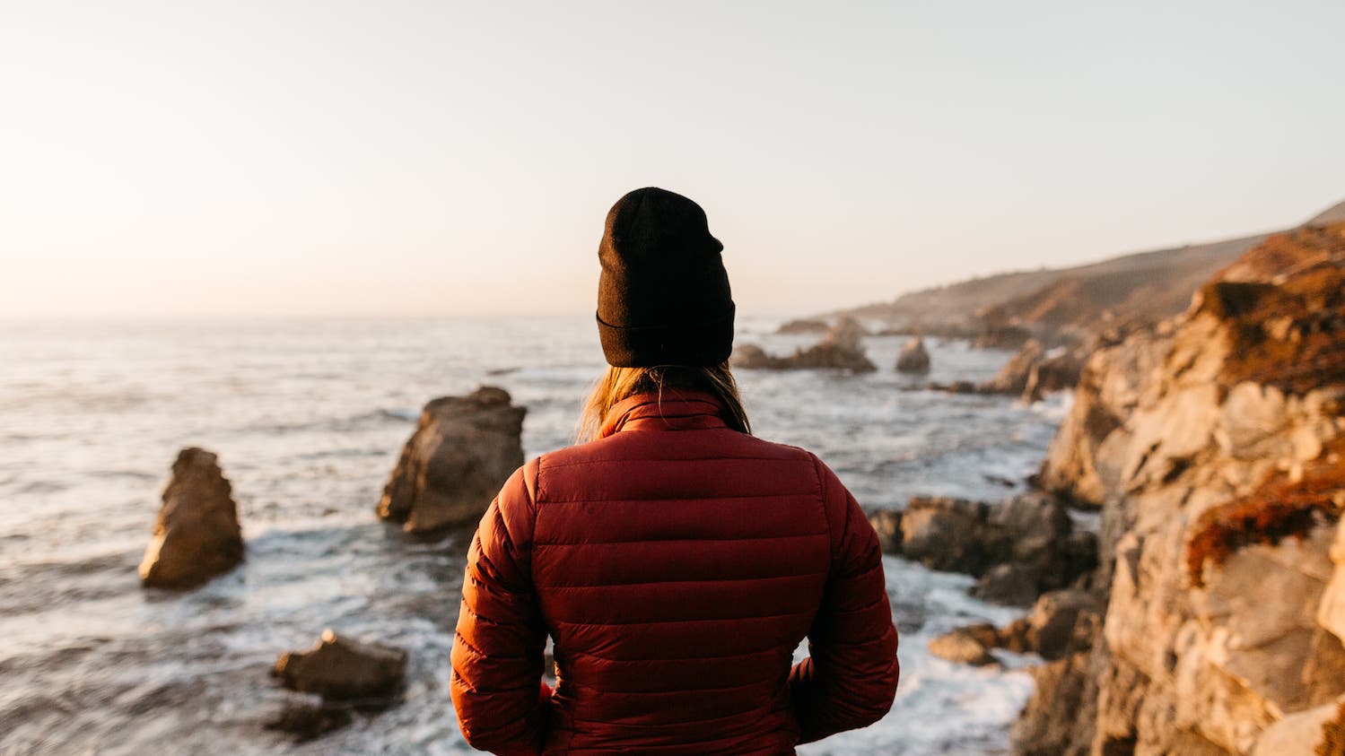 woman in big sur looks at ocean