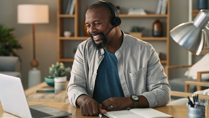 A man speaks on a headset and uses service swarming