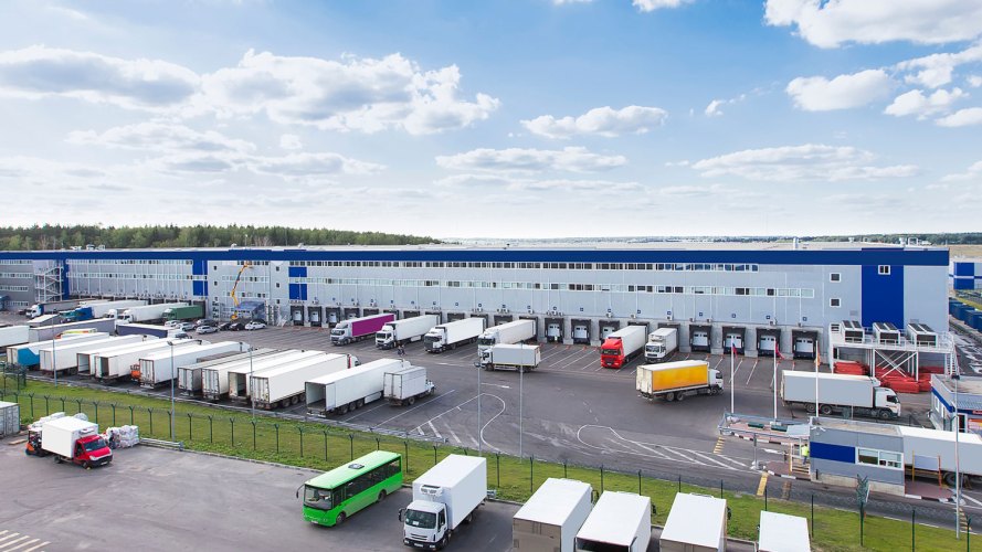 Cargo trucks at a logistics facility.