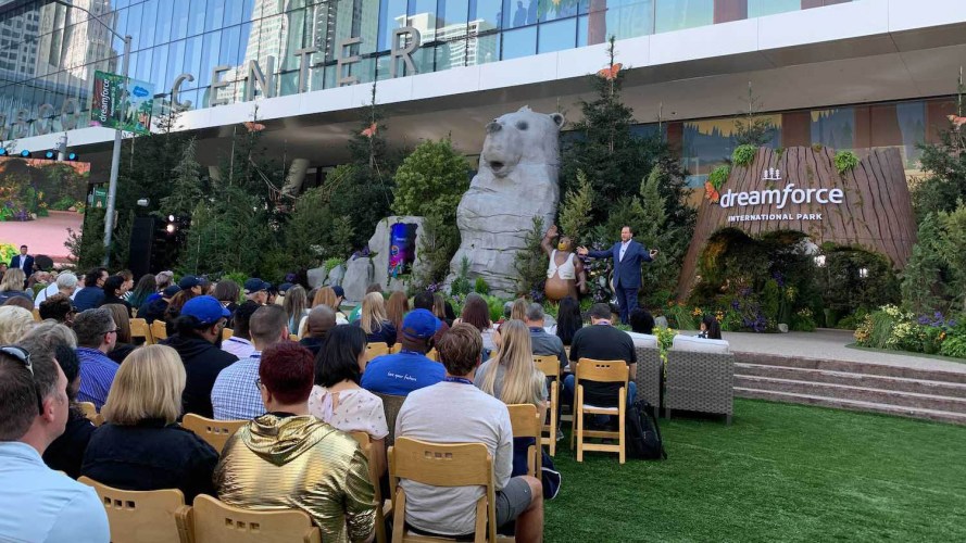 speakers on stage and an audience at Dreamforce, a Salesforce in-person event