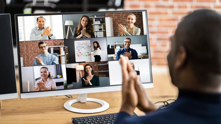 man using sign language while on a video call with colleagues