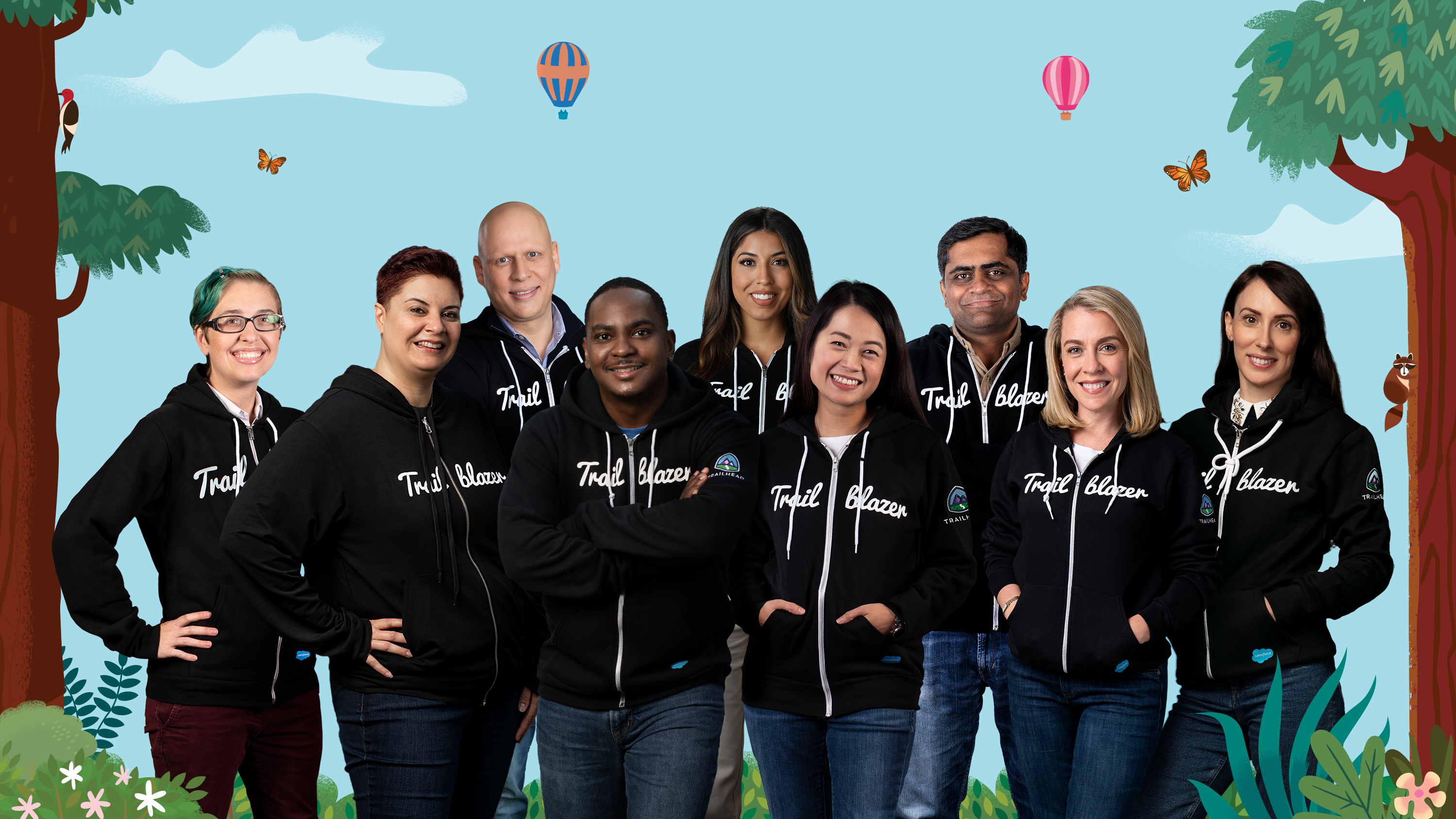 A group photo of 9 Trailblazers all sporting their iconic black Trailblazer hoodies.