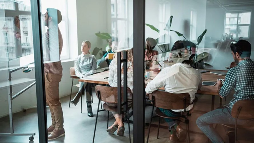 People standing and sitting in an office