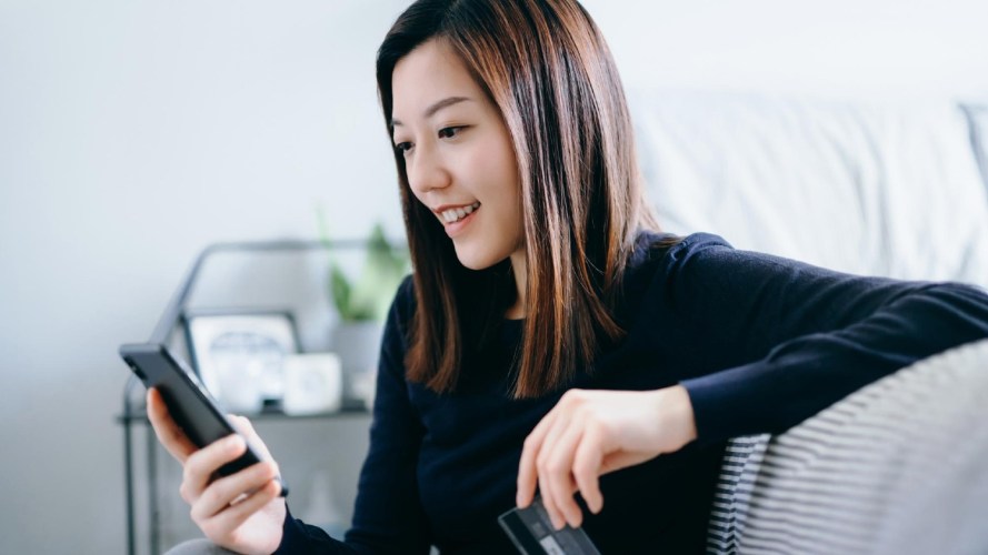 Photo of woman looking at mobile phone: Marketing cloud release