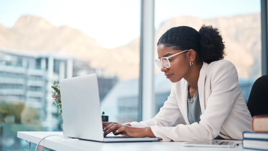 Image of woman on laptop // Protecting Data with the Principle of Least Privilege