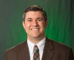 Geoff DeLizzio, Chief Development Officer at the Epilepsy Foundation of America, in front of a green background