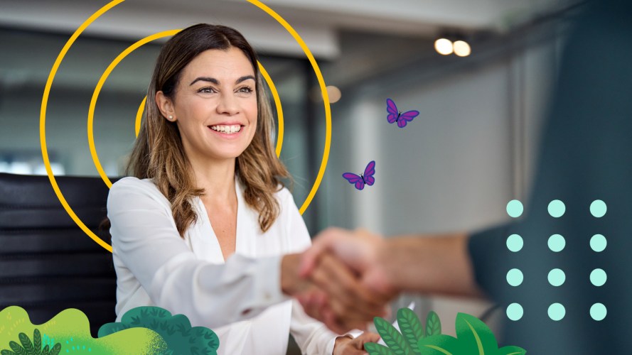 Woman shaking hands during a consultative sales session