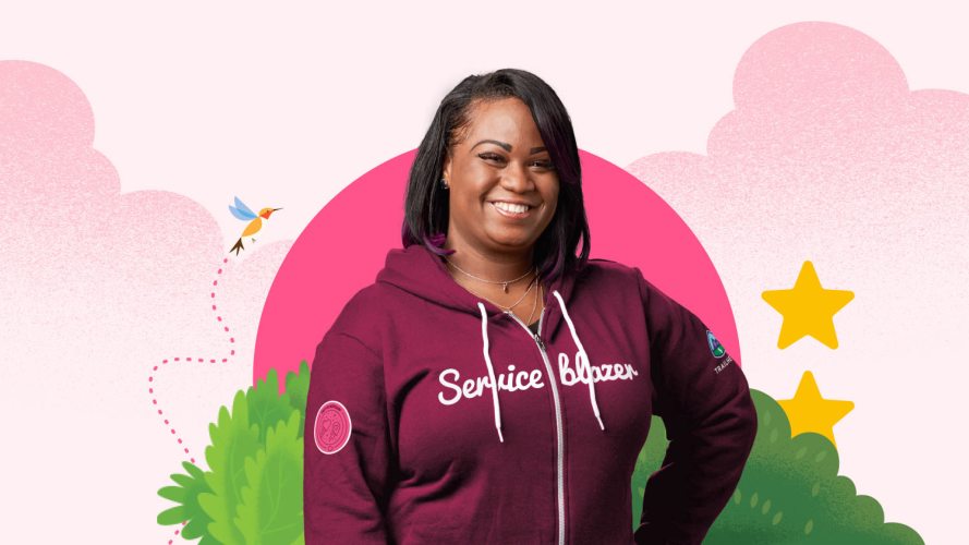 [Customer service career path]: A picture of Shonnah Hughes smiling in her maroon Serviceblazer hoodie
