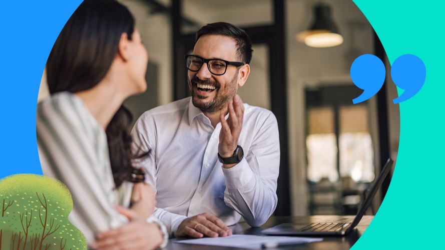 Photo of two people having a conversation while smiling. Sandler Selling Method