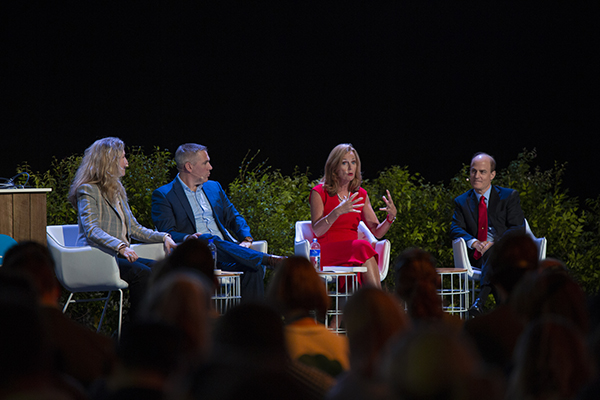 image of four people sitting on a stage