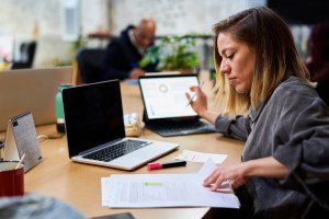 woman focused on data preparation for report