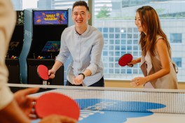 Employees in the Singapore office take a break for a game of ping pong.