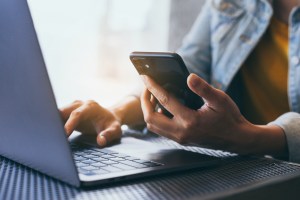 hands typing on a keyboard