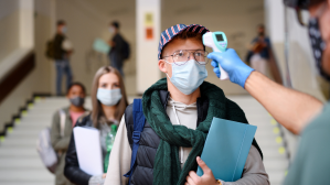 Student getting a temperature check on campus